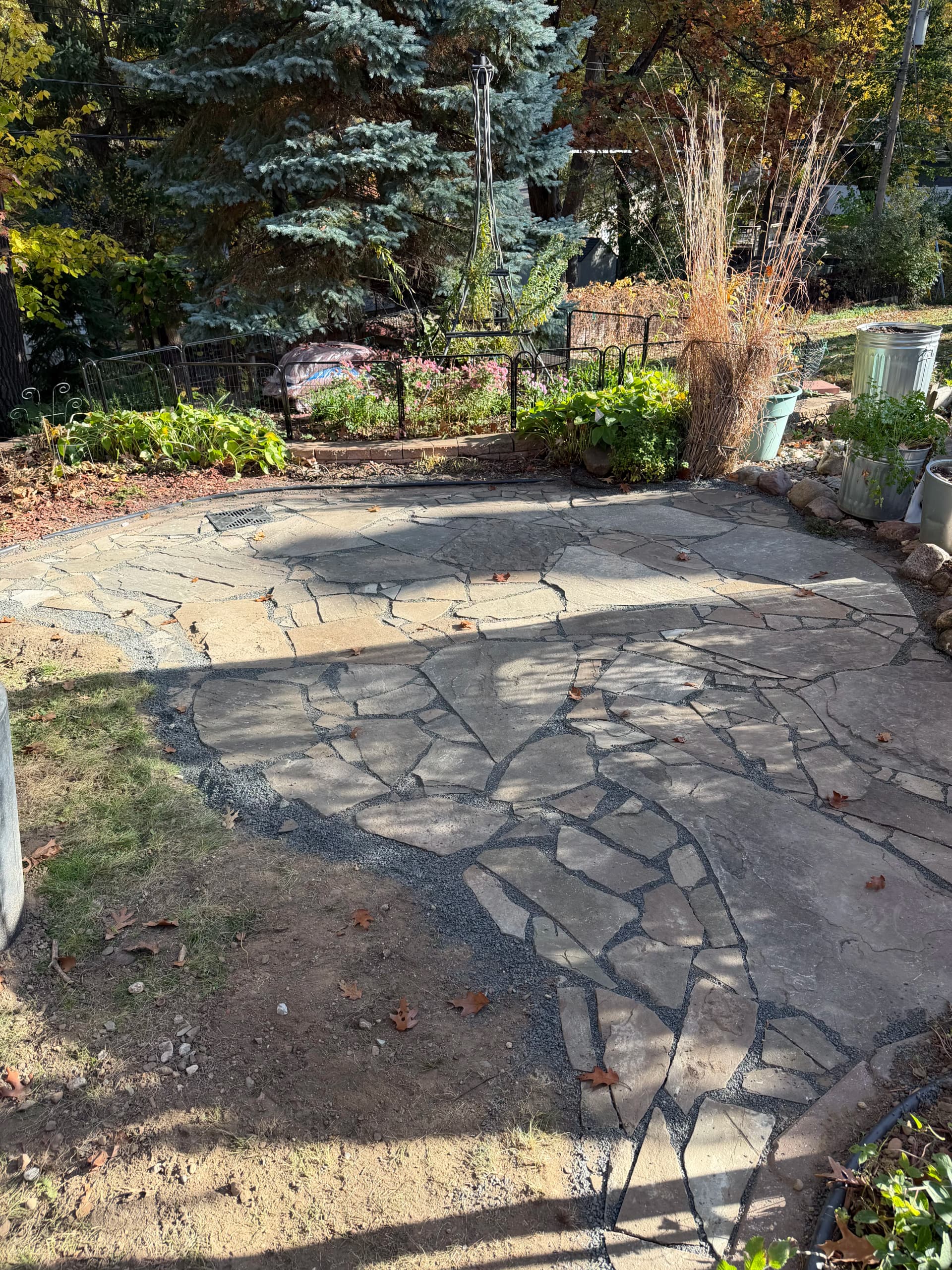Gallery photos for Flagstone Patio With Black Granite Joints and French Drain: Image #2