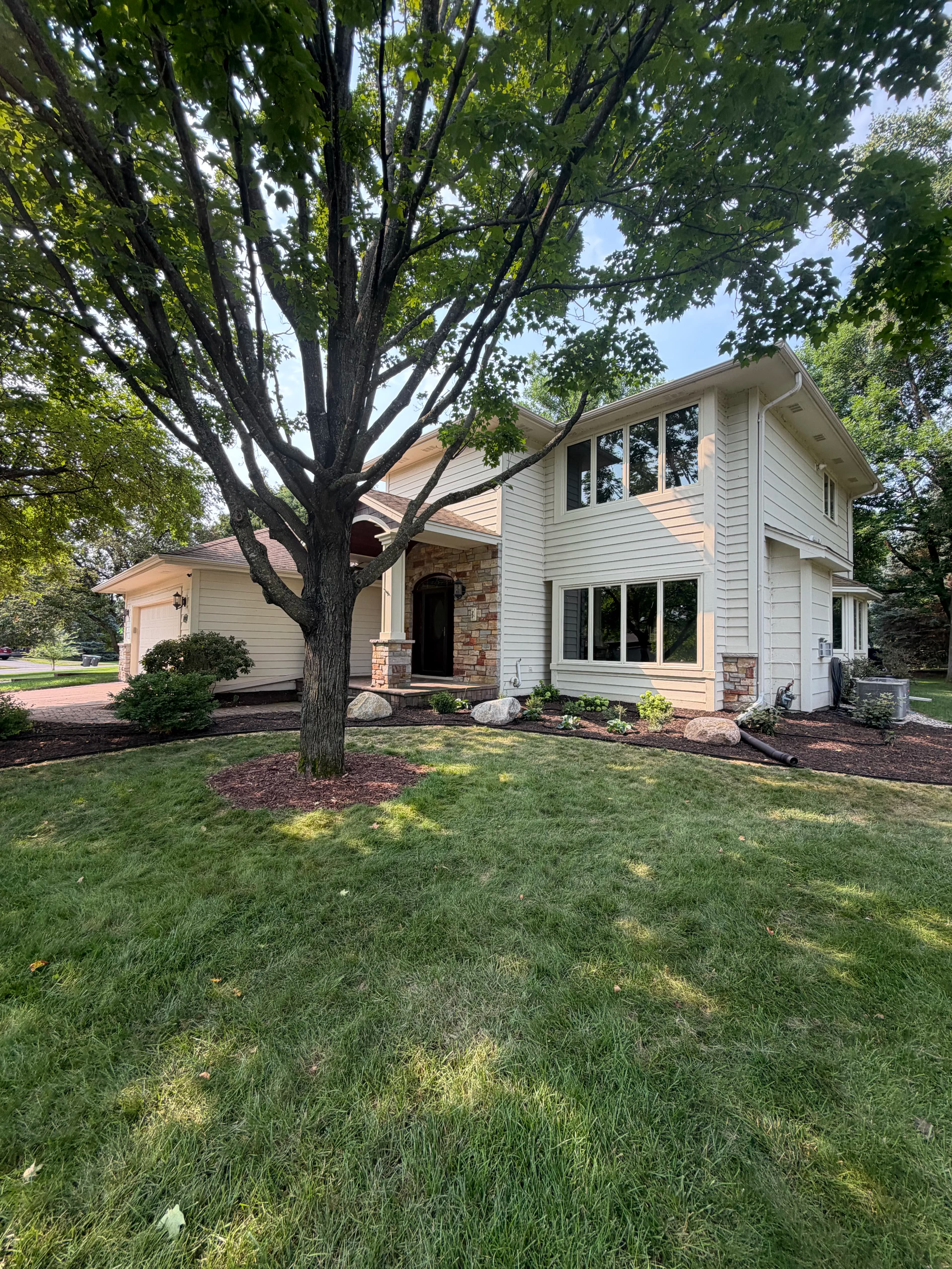 Project Mulch, River Rock, and Metal Edging Refresh in Eden Prairie image