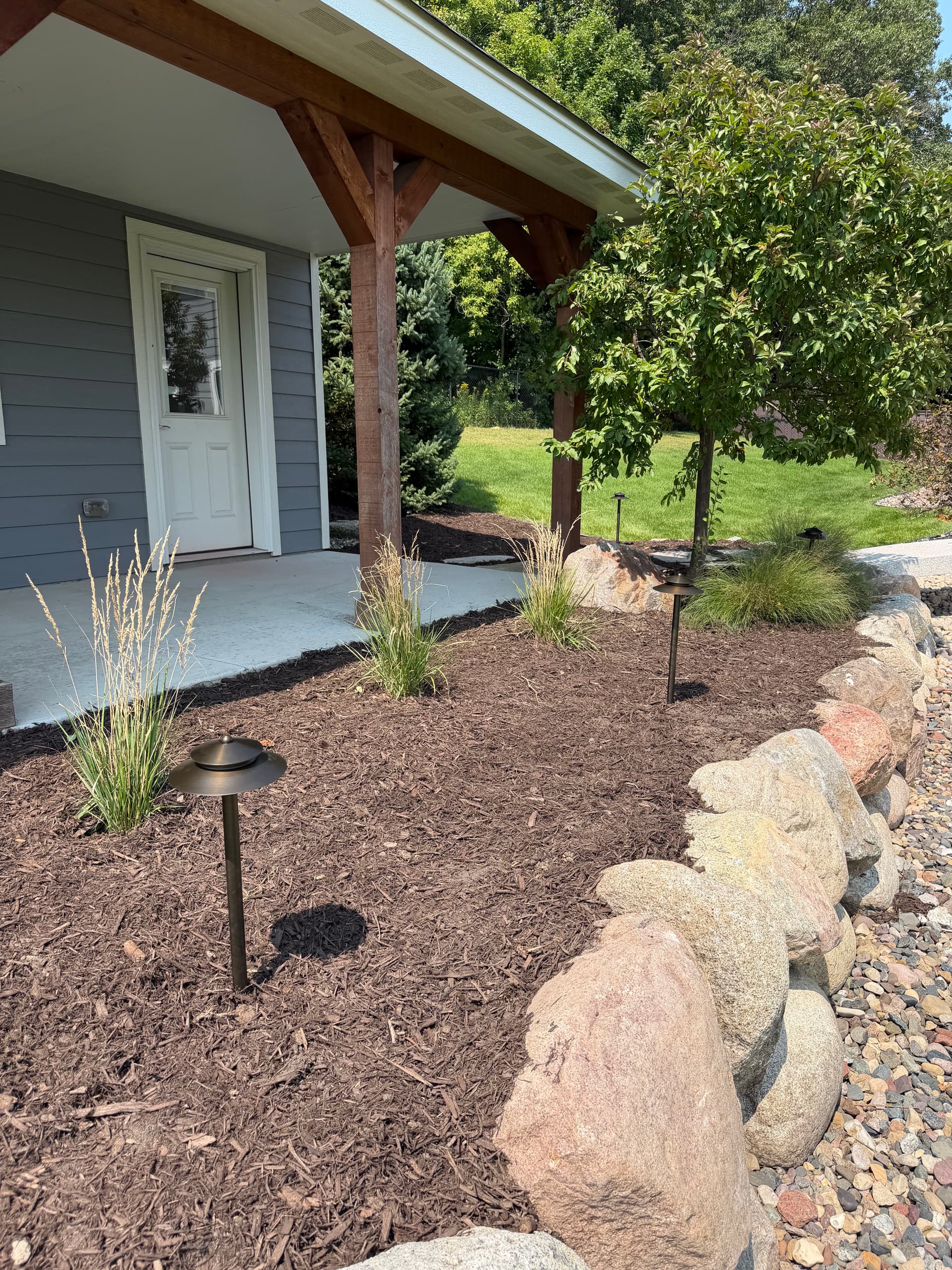 Fresh Mulch, Clean Beds, and Landscape Lighting Done Right
