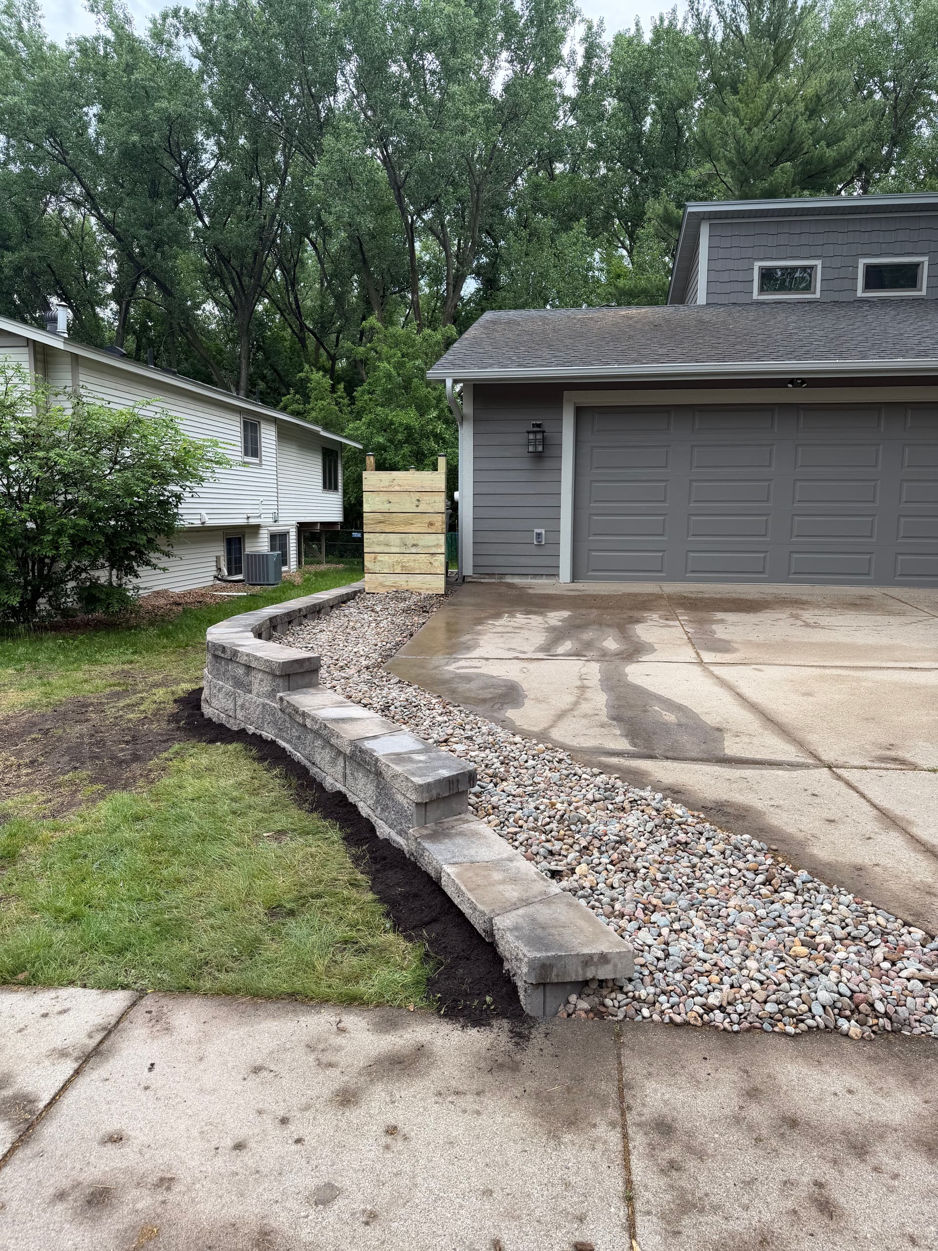 40-Foot Retaining Wall Fixes Drainage and Code Issues in Eden Prairie image